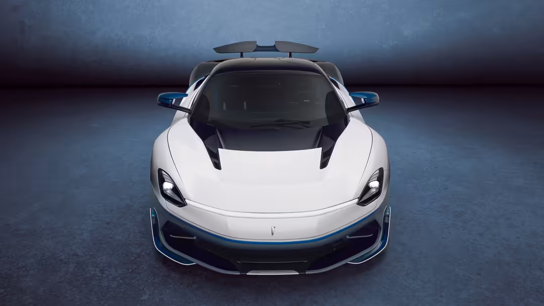 White Pininfarina Battista Anniversario hypercar photographed from above with gull-wing doors open, showcasing sleek aerodyna