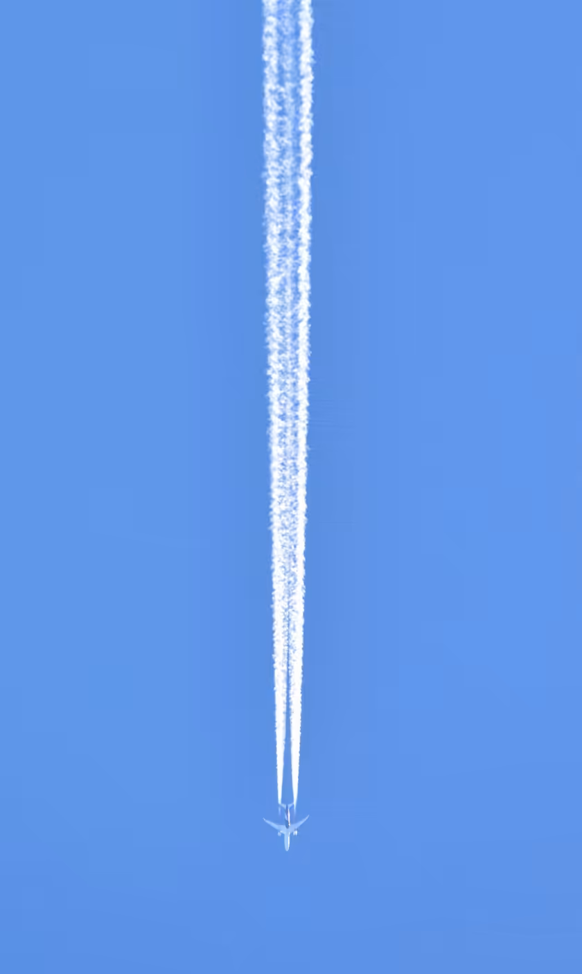 Aircraft Contrail Against Clear Blue Sky