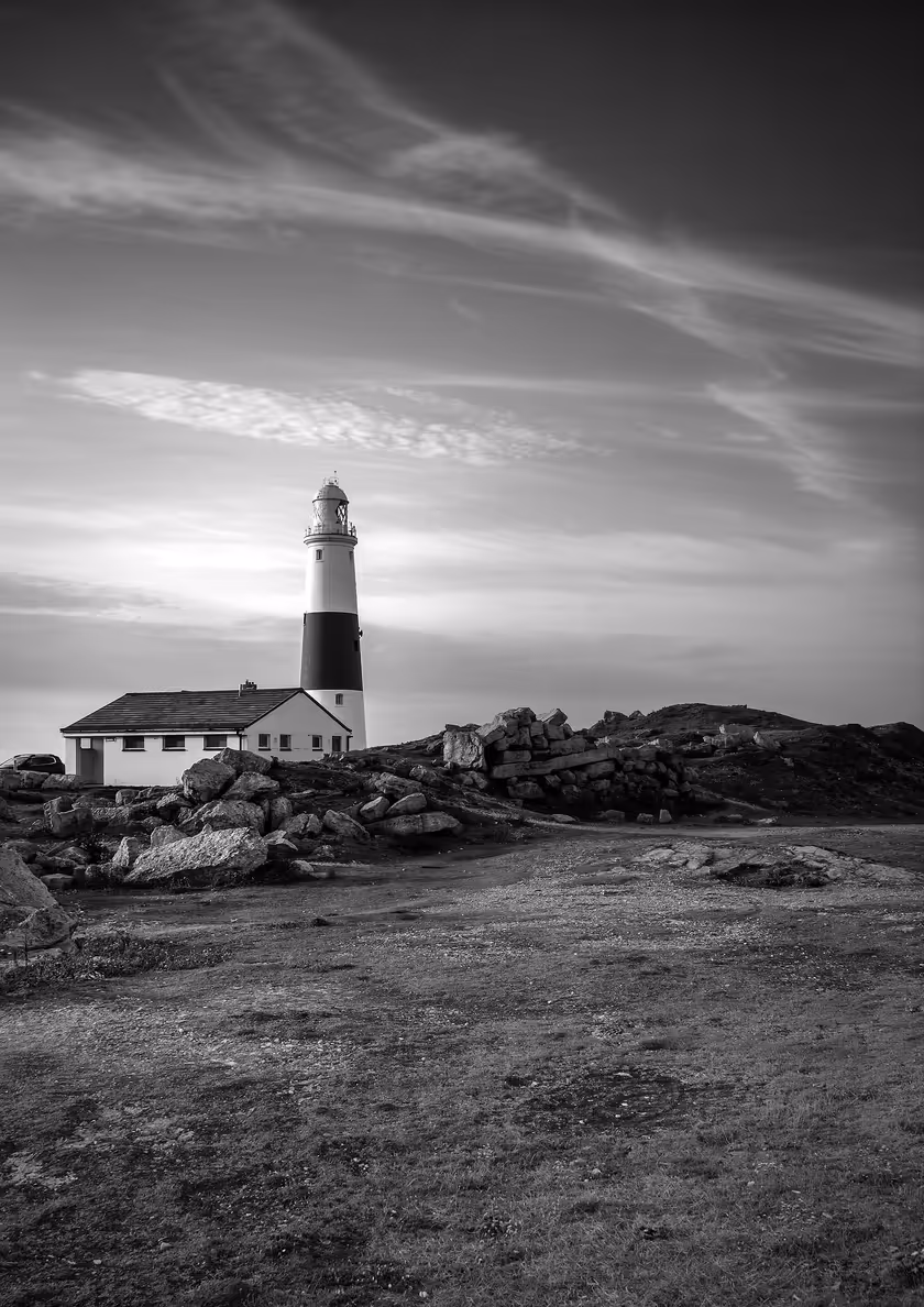 Coastal Lighthouse With Rocky Shore